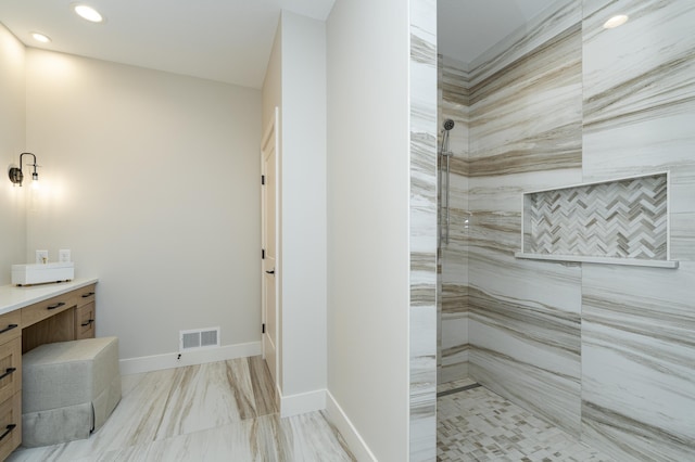 full bathroom with visible vents, baseboards, a tile shower, recessed lighting, and vanity