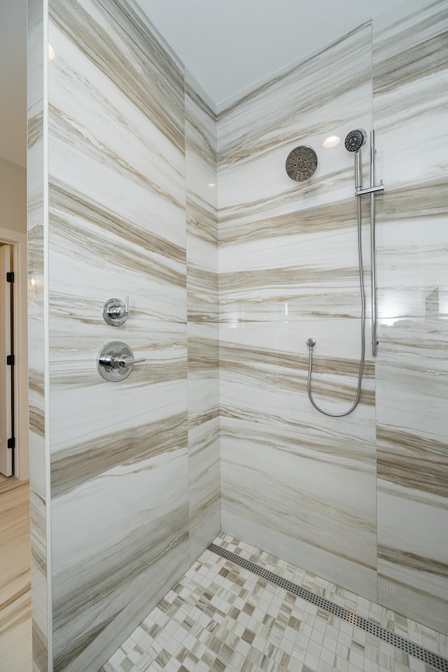 full bathroom with tiled shower