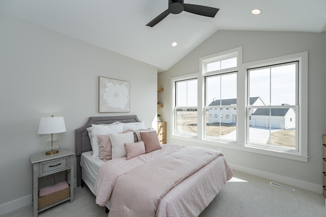 bedroom with visible vents, a ceiling fan, carpet, baseboards, and vaulted ceiling