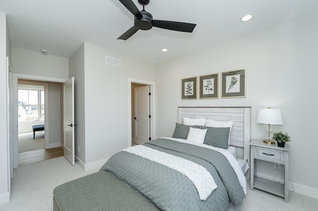 bedroom with visible vents, baseboards, ceiling fan, light colored carpet, and recessed lighting