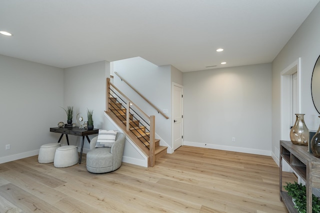 interior space with recessed lighting, baseboards, and wood finished floors