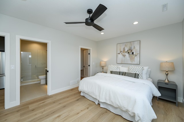 bedroom featuring freestanding refrigerator, recessed lighting, light wood-type flooring, and baseboards