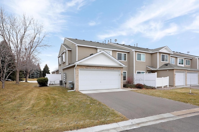 view of front facade with a front lawn and a garage