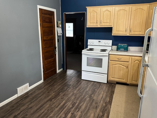 kitchen with light brown cabinets, white appliances, and dark wood-type flooring