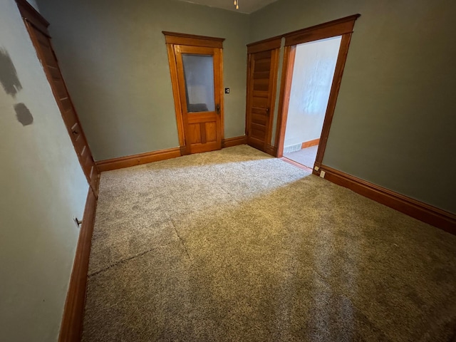 spare room featuring carpet floors