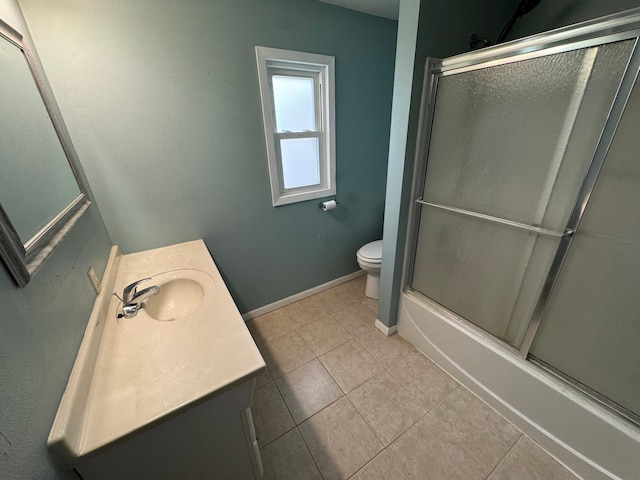 full bathroom with tile patterned flooring, vanity, toilet, and enclosed tub / shower combo