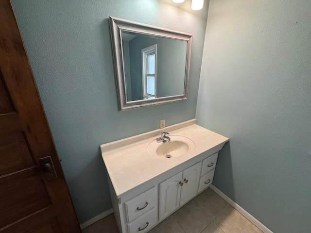 bathroom with tile patterned flooring and vanity