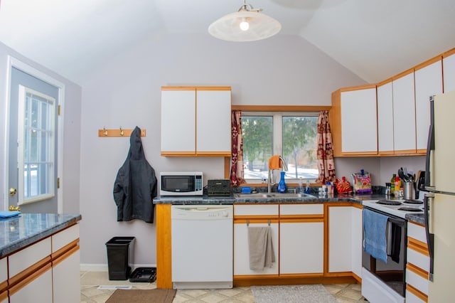 kitchen with white cabinetry, white appliances, sink, and vaulted ceiling