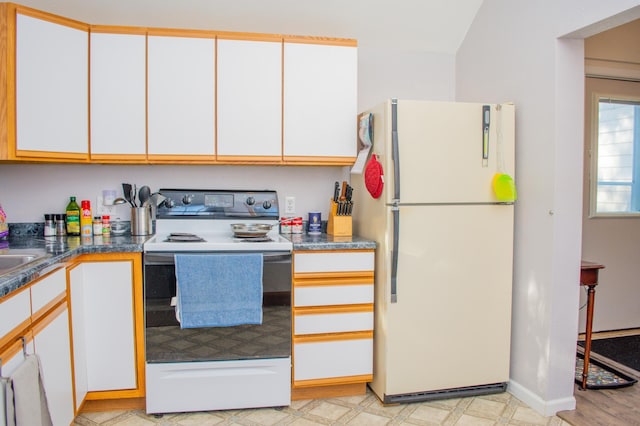 kitchen featuring white cabinets, white appliances, and light hardwood / wood-style floors