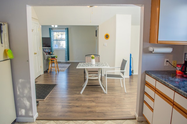 dining area with light hardwood / wood-style flooring