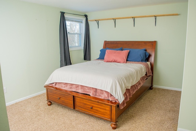 bedroom with light colored carpet