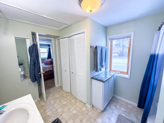 bathroom with plenty of natural light and vanity