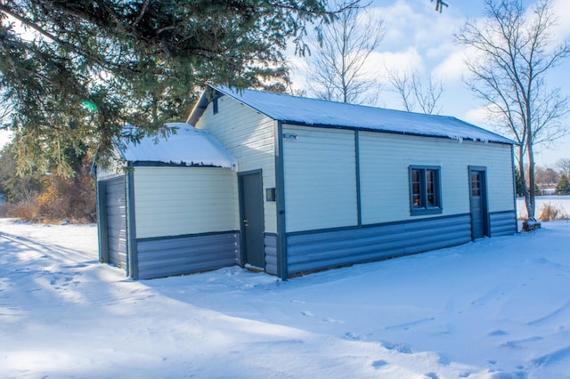 view of snow covered garage