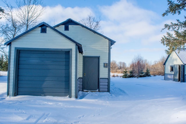 view of snow covered garage