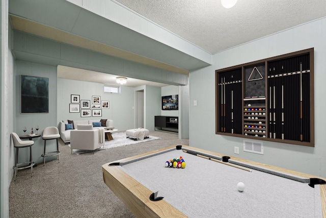 playroom with pool table and a textured ceiling