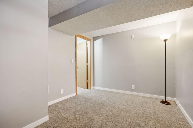 basement with a textured ceiling and carpet flooring