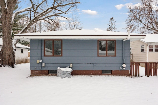 view of snow covered house