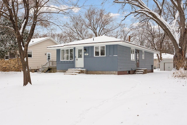 view of front of house featuring a storage unit