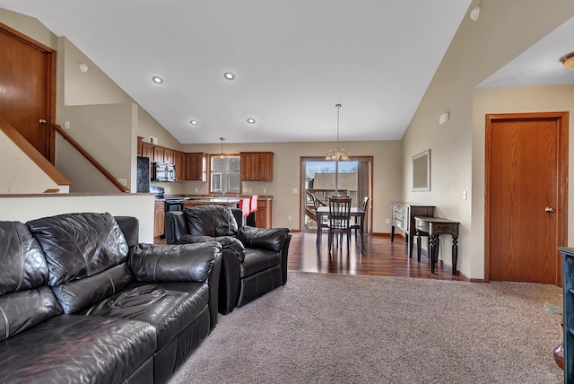 living area with carpet flooring, recessed lighting, baseboards, and high vaulted ceiling