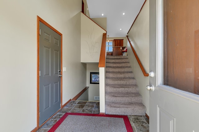 staircase featuring recessed lighting and baseboards