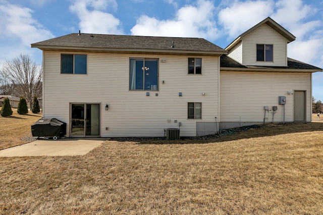 rear view of house featuring central air condition unit, a patio, and a lawn