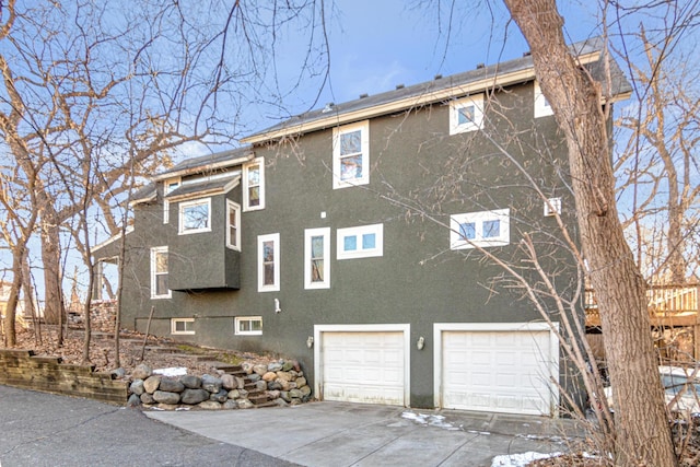 view of side of property with a garage