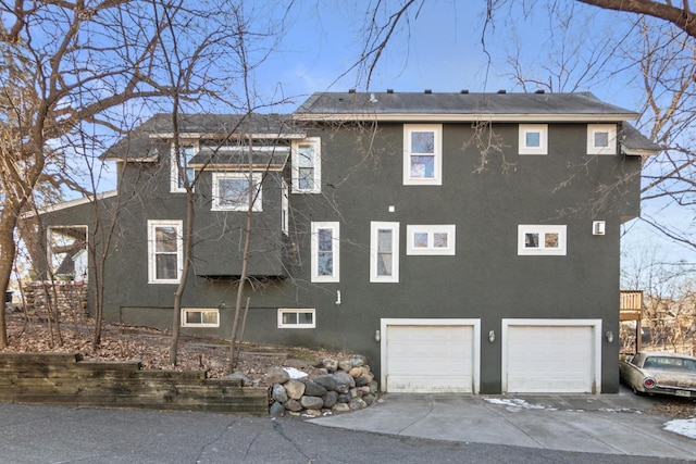 view of side of home with a garage