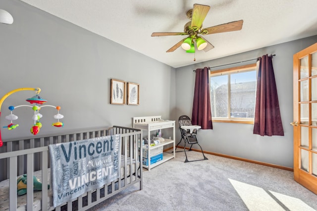 983 County Road D E, Vadnais Heights, MN 55109 - carpeted bedroom with ceiling fan, baseboards, and a nursery area