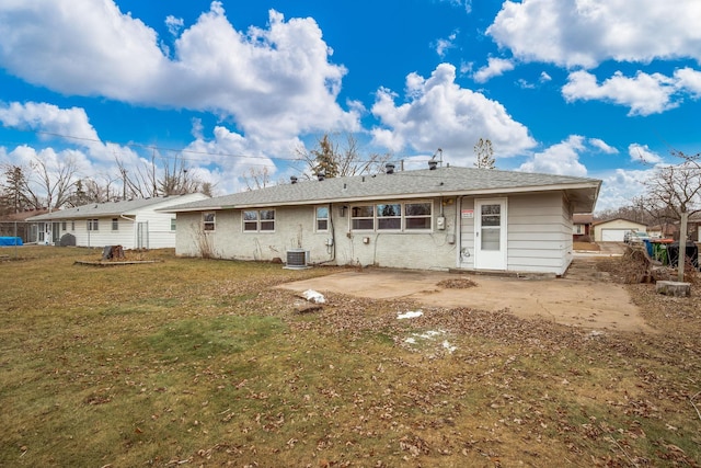 rear view of house featuring a patio area, a yard, and cooling unit