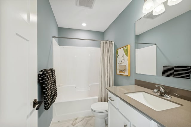 full bathroom with vanity, shower / tub combo, and toilet