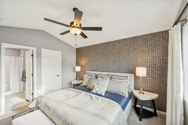 carpeted bedroom with ceiling fan, lofted ceiling, and tile walls