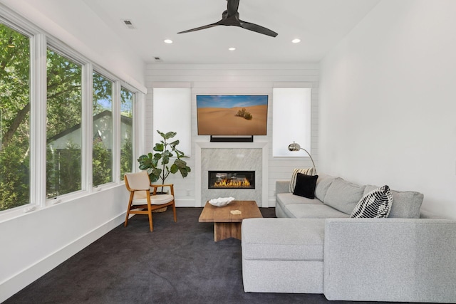 4540 Upton Ave S, Minneapolis, MN 55410 - living room with dark carpet, a ceiling fan, baseboards, recessed lighting, and a glass covered fireplace