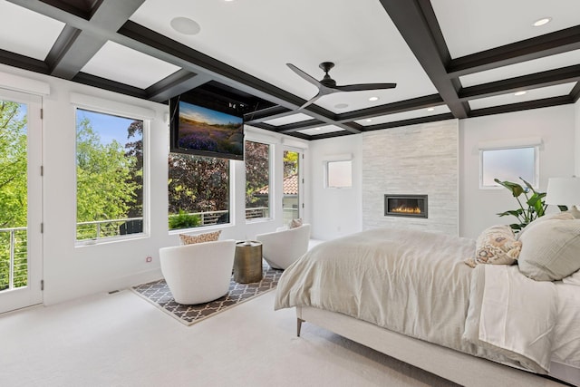 4540 Upton Ave S, Minneapolis, MN 55410 - carpeted bedroom with coffered ceiling, beamed ceiling, multiple windows, a fireplace, and access to exterior