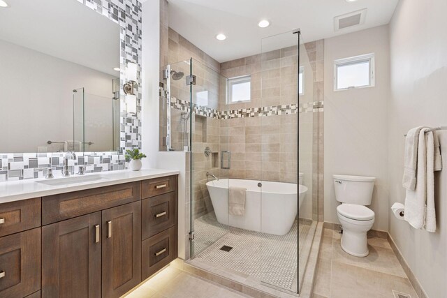 4540 Upton Ave S, Minneapolis, MN 55410 - bathroom featuring plenty of natural light, toilet, a stall shower, and recessed lighting