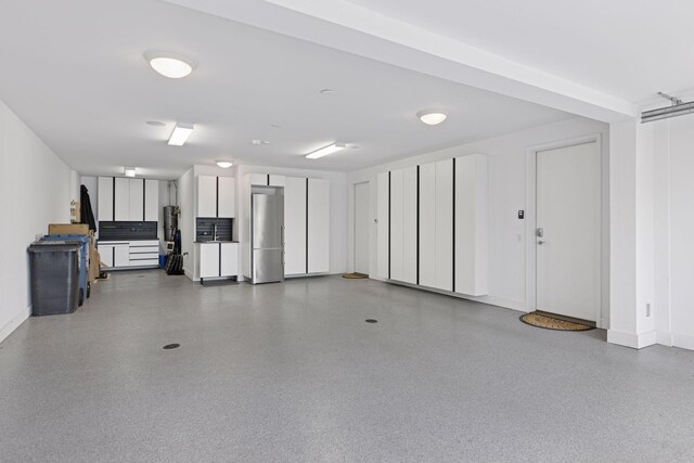 4540 Upton Ave S, Minneapolis, MN 55410 - garage with freestanding refrigerator and baseboards