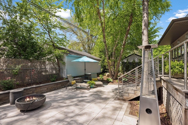 4540 Upton Ave S, Minneapolis, MN 55410 - view of patio / terrace with a fire pit, stairway, and fence