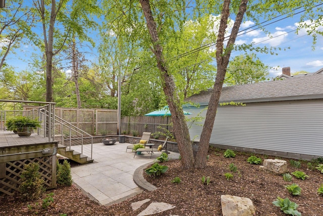 4540 Upton Ave S, Minneapolis, MN 55410 - view of yard with a patio area, a wooden deck, fence, and stairway