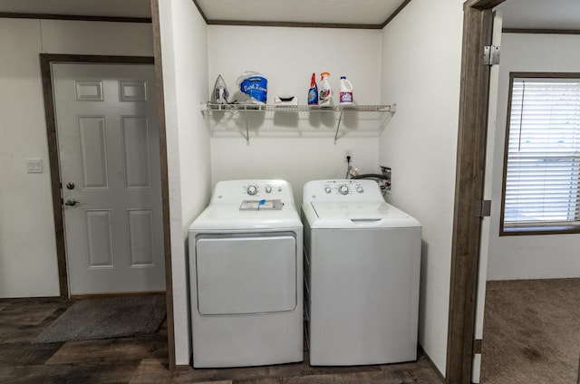 washroom featuring crown molding, dark hardwood / wood-style flooring, washer and dryer, and a textured ceiling