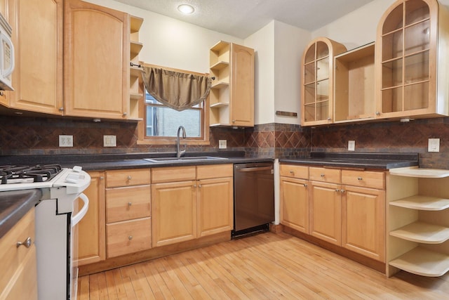 kitchen with dishwasher, sink, tasteful backsplash, light hardwood / wood-style flooring, and light brown cabinetry