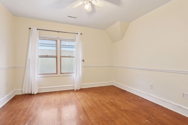 spare room featuring hardwood / wood-style floors and ceiling fan