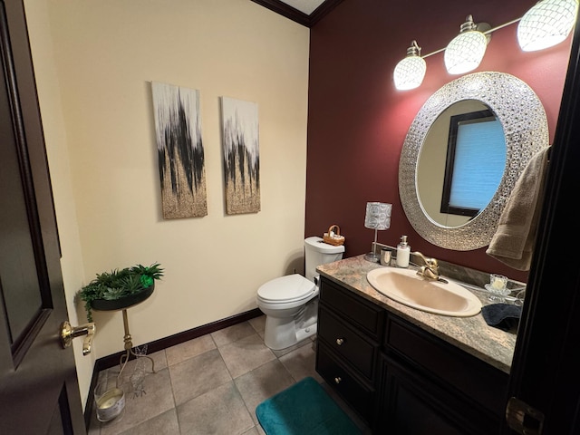 bathroom with tile patterned floors, vanity, toilet, and crown molding