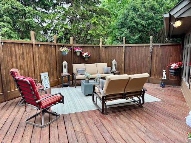 wooden terrace with outdoor lounge area