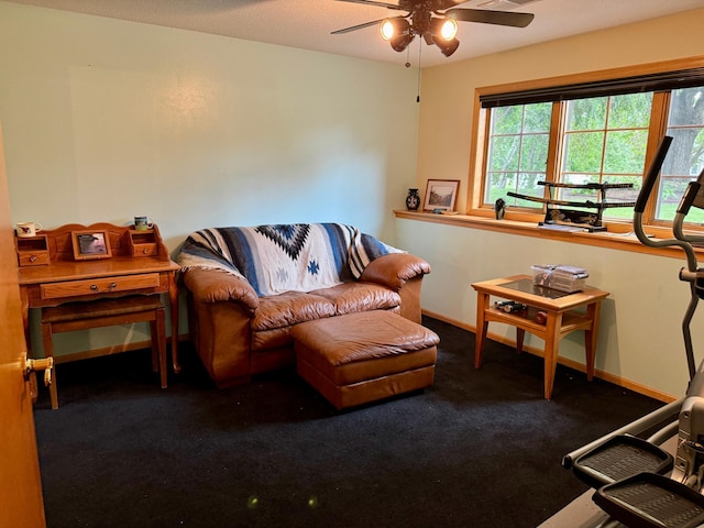 living room with dark colored carpet and ceiling fan