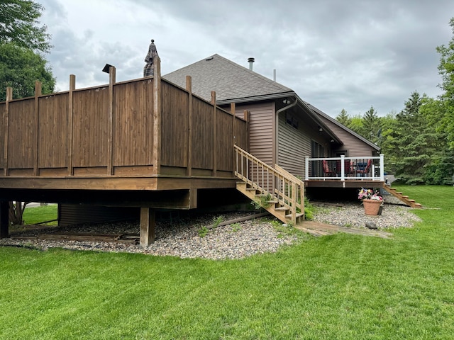 rear view of house featuring a lawn