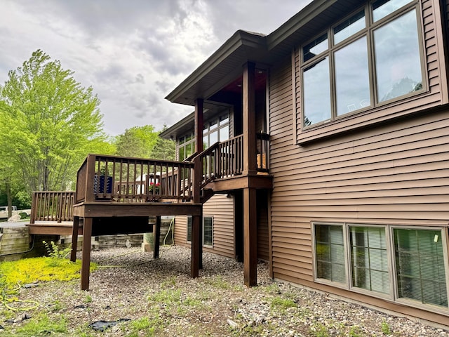 view of side of property featuring a wooden deck