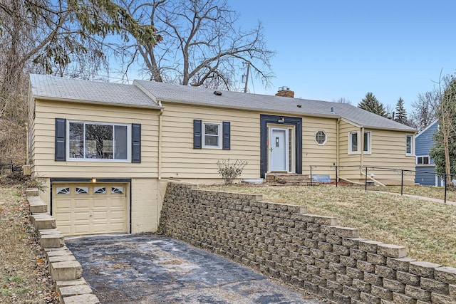 single story home featuring a garage