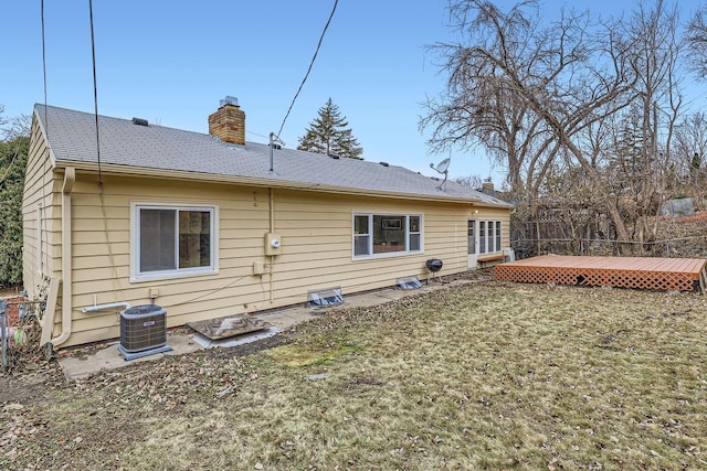 back of house featuring central AC and a wooden deck