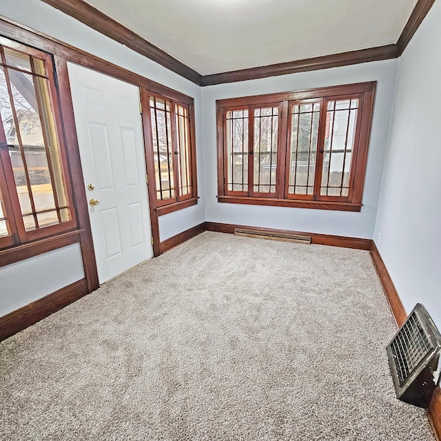 carpeted empty room with ornamental molding