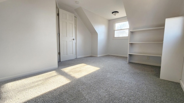 bonus room featuring carpet flooring and lofted ceiling