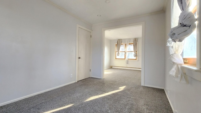 carpeted spare room featuring ornamental molding and a baseboard heating unit